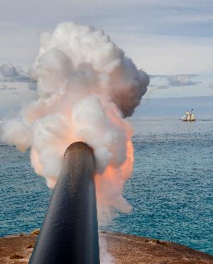 Cannon firing from Fort St. Catherine